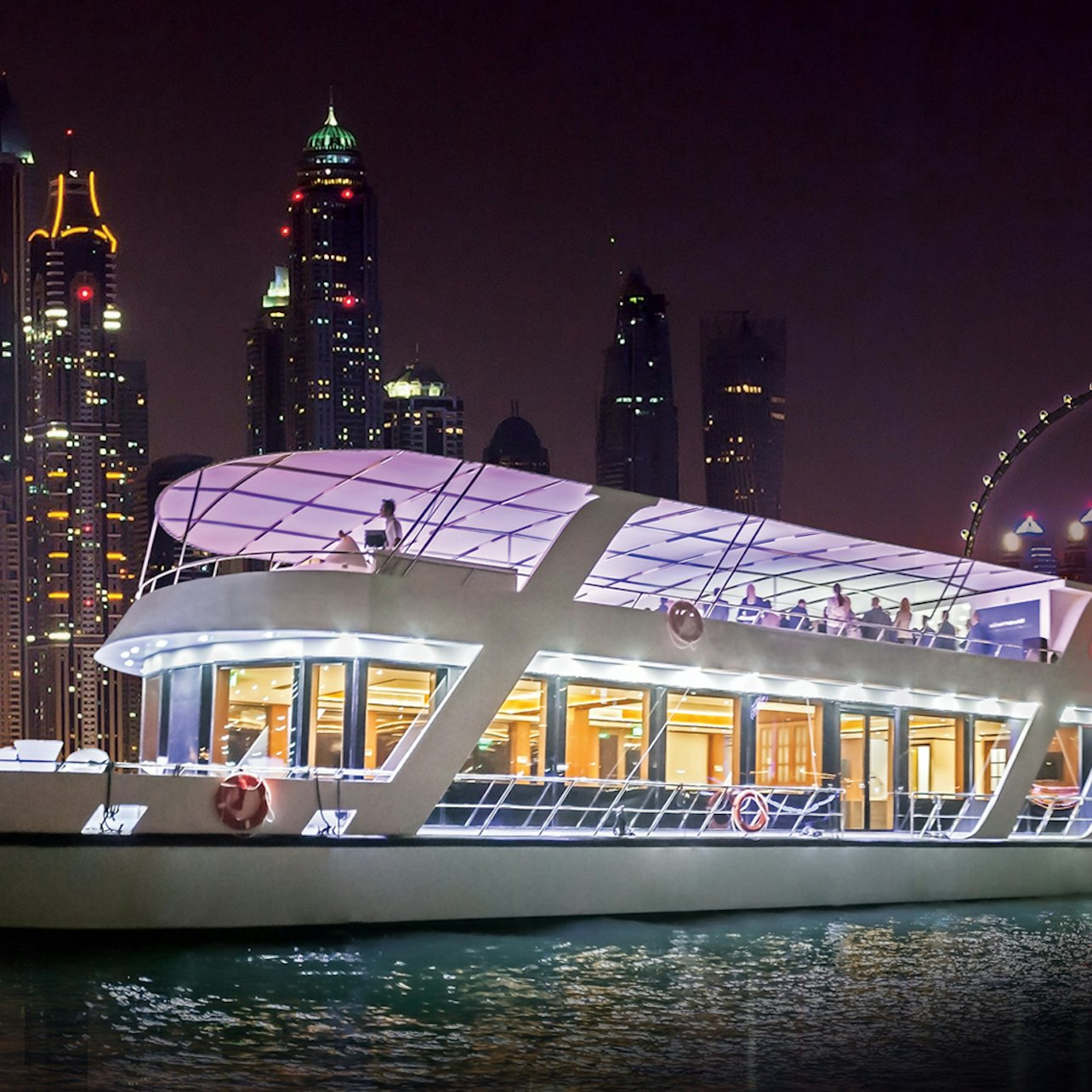 Sail through Dubai Marina on a luxurious dinner cruise savoring a gourmet buffet and live music while enjoying stunning views of the illuminated skyline and refreshing ocean breeze.